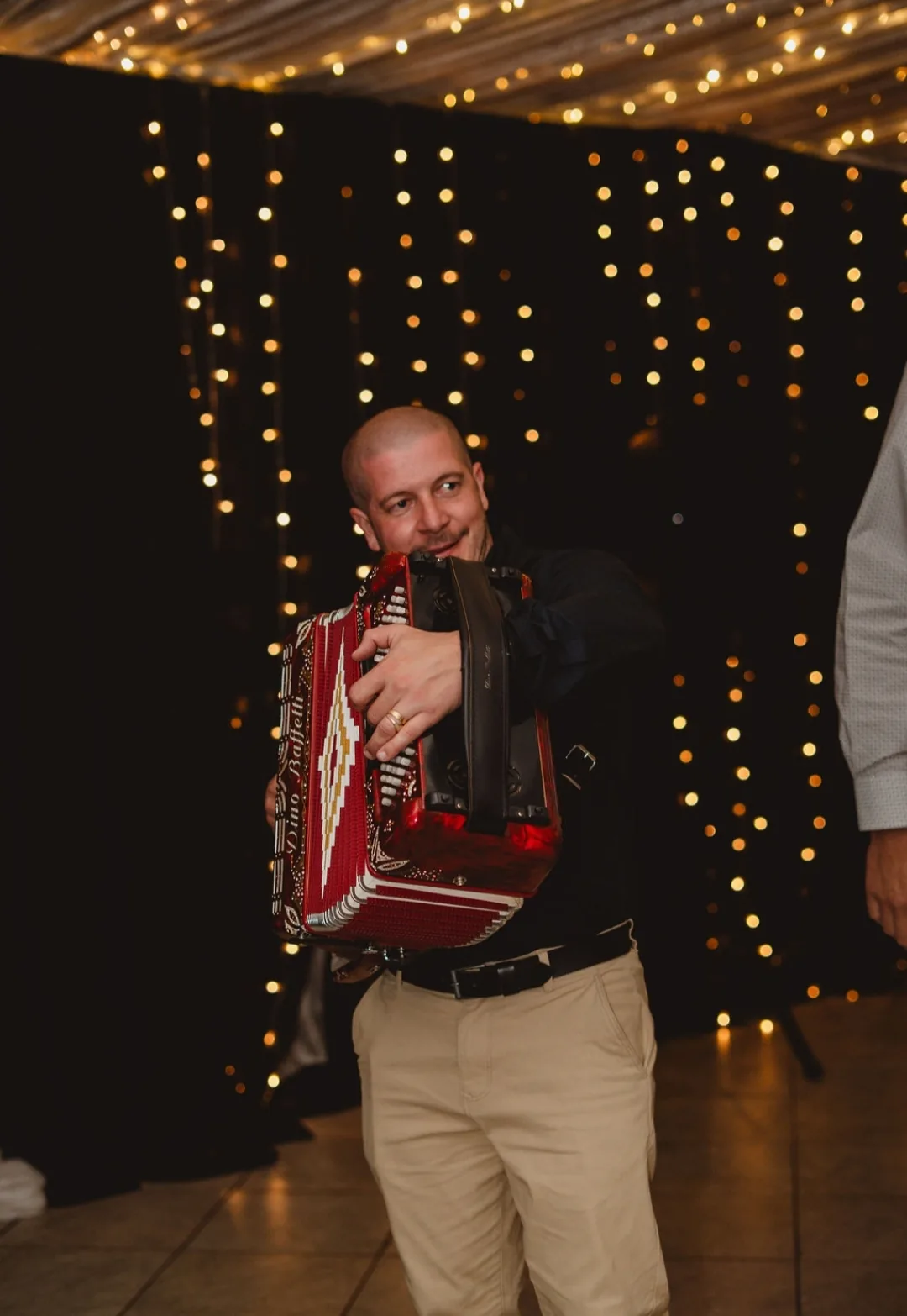 Ricardo playing under fairy lights